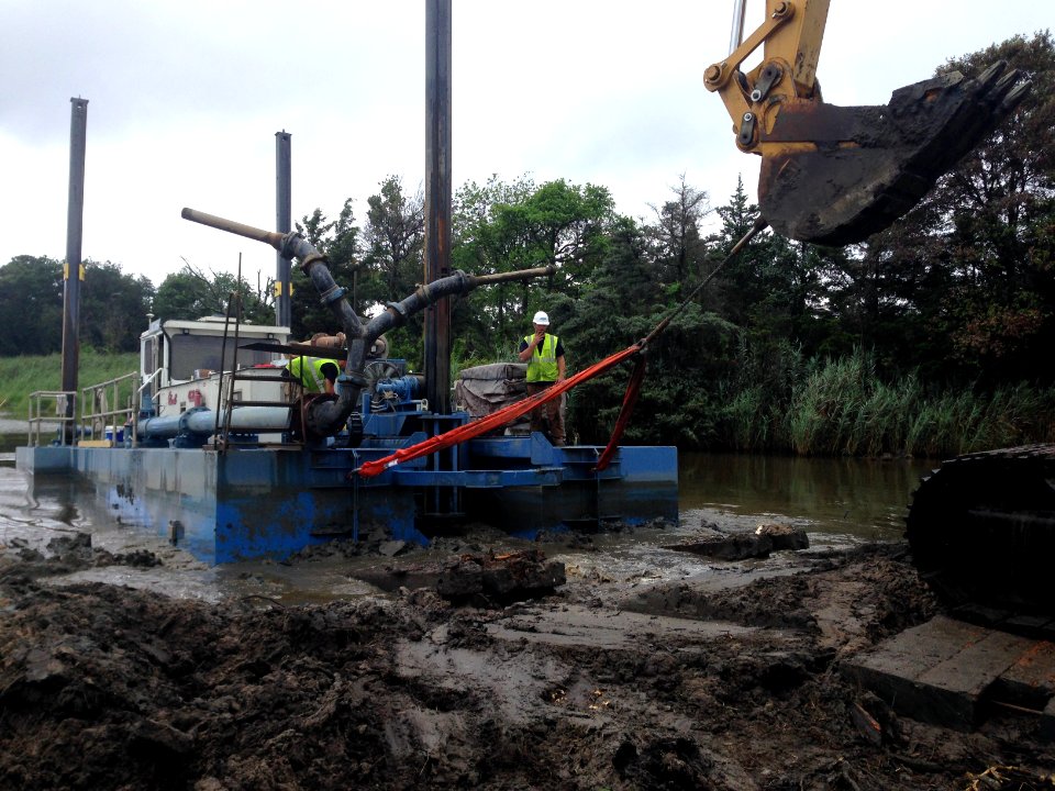 Prime Hook National Wildlife Refuge marsh restoration - pulling Victory on bank for repair