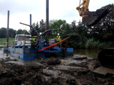 Prime Hook National Wildlife Refuge marsh restoration - pulling Victory on bank for repair
