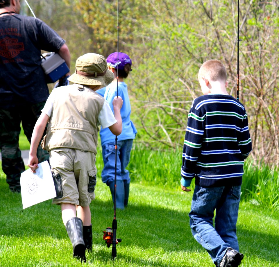 Kids carrying their poles