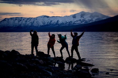 Millennials pose for a selfie on Lake McDonald photo
