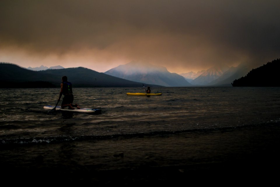 Paddlers on Lake McDonald under a Smokey Sky