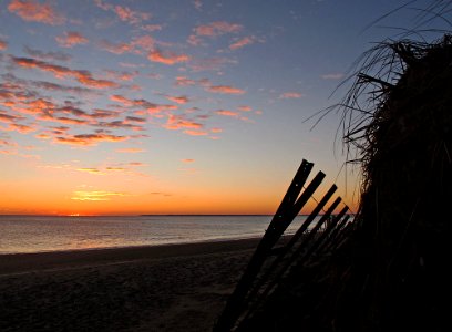 Sunrise and snow fence photo