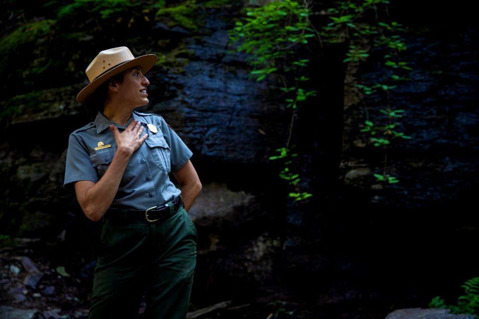A park ranger enjoying a hike to Avalanche Lake.