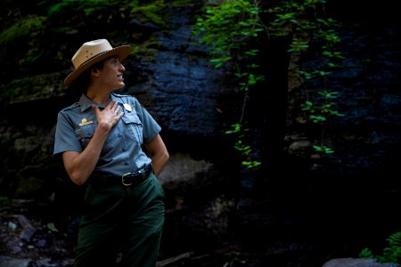 A park ranger enjoying a hike to Avalanche Lake.