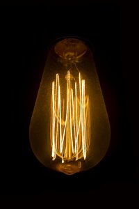 Filament glowing light bulb photo