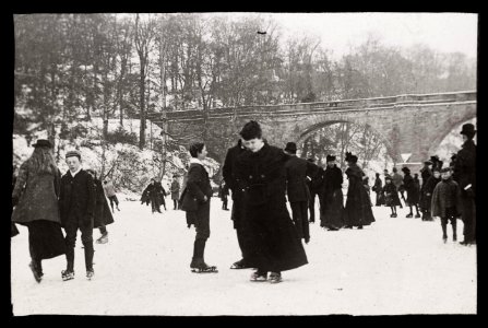 Ice skating on a frozen river, ca 1900 photo