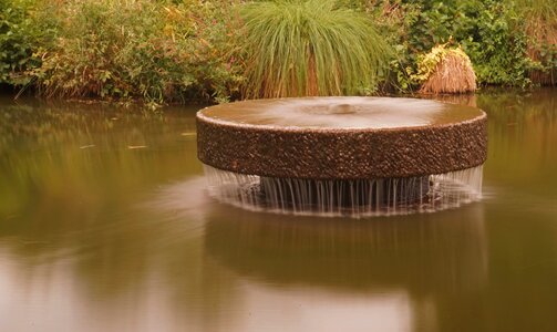 Pond lake stone fountain photo