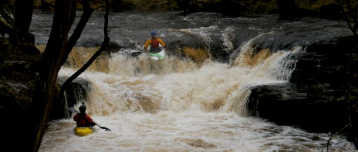 Paddlers on the river Nedd Fechan