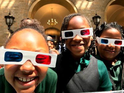 Girls from Malcom X Elementary School use 3D glasses to view USDA anaglyphs.