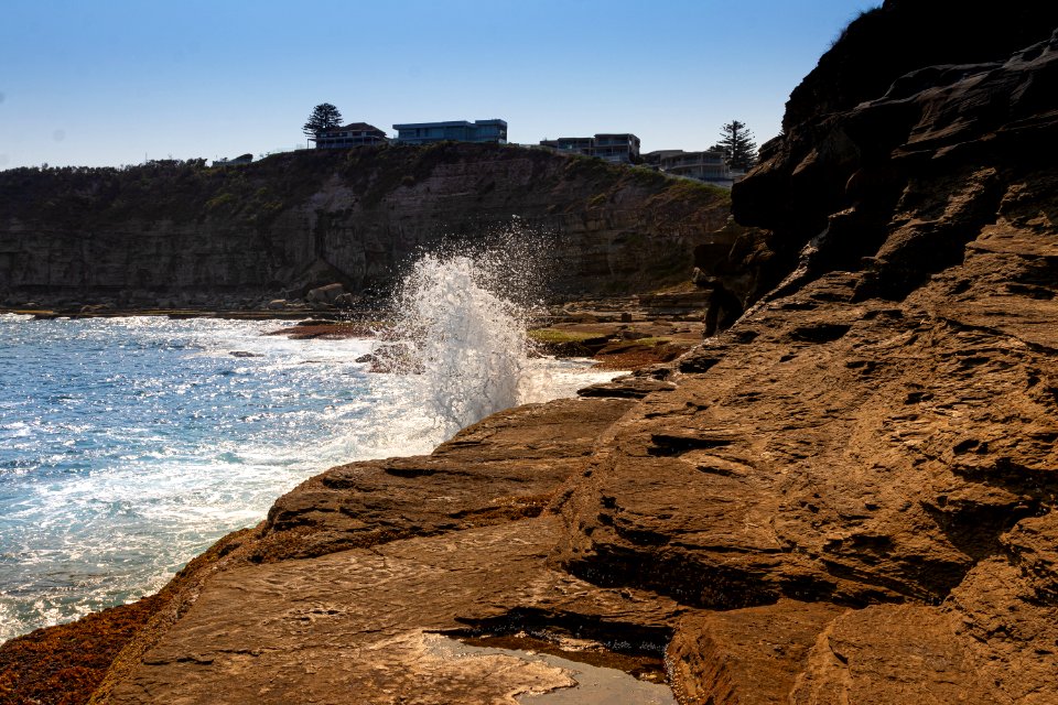 Wave hitting rocks