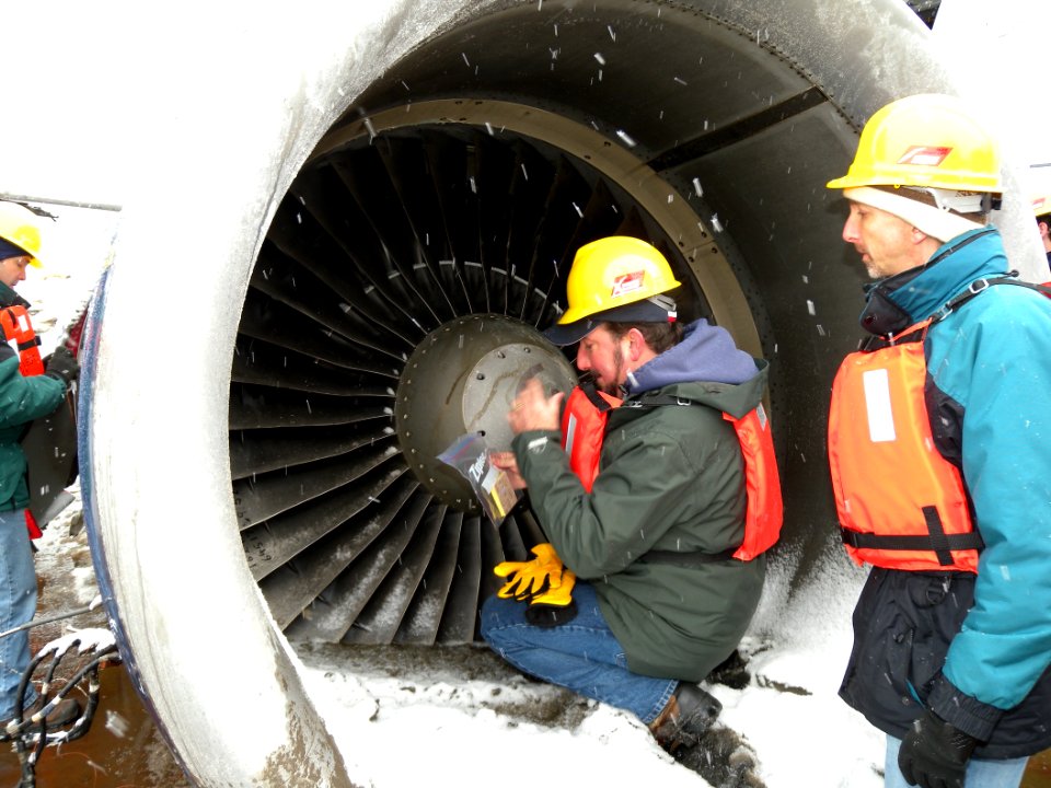 Mike Begier collecting snarge and other evidence NTSB image