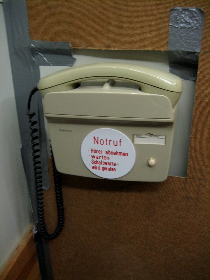 Old emergency hotline in an elevator