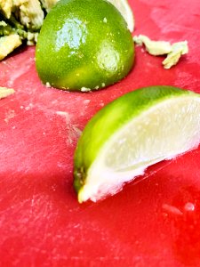 Sliced Lime on Red Cutting Board photo