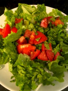 Breakfast: Salad with lettuce and tomato on the vine. Dressed with olive oil and black pepper.