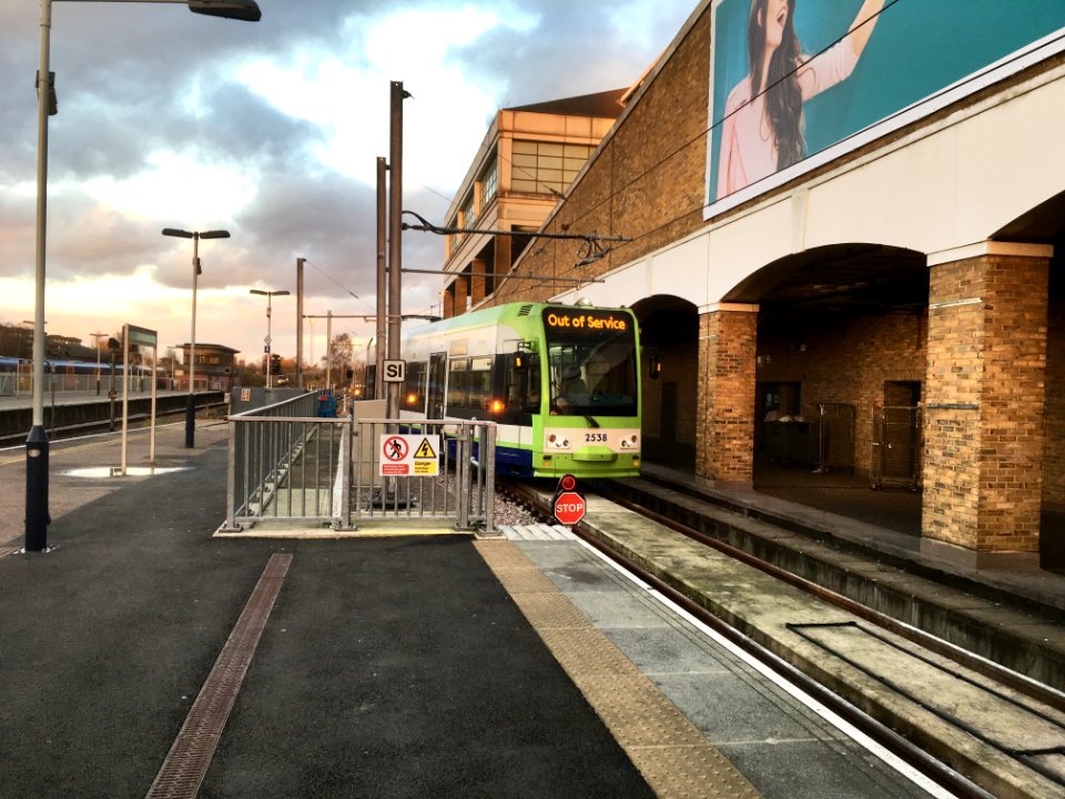 Croydon tram 2538 stabled beyond platform 10b at Wimbledon.
