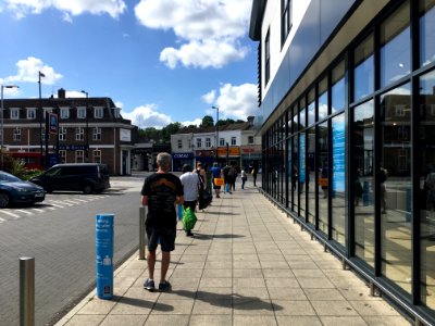 Shoppers queuing to enter the Aldi store in Coulsdon photo