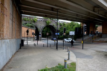 Coulsdon railway bridge seen through the new bridge carrying the relief road