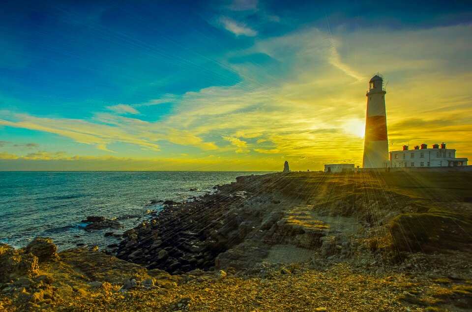 Lighthouse ocean sunset