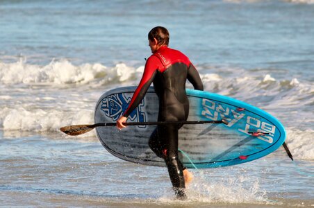 Beach surfboard wet photo