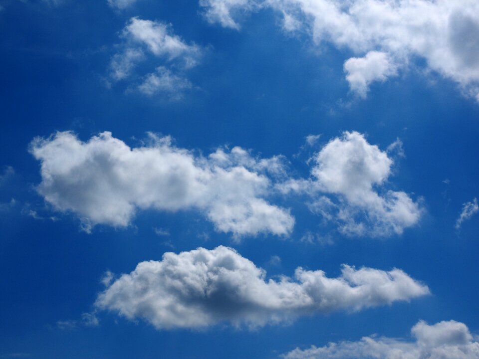 Clouds form white cumulus clouds