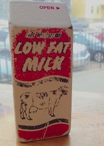 Open As in a Faded Package of All Natural Low Fat Milk