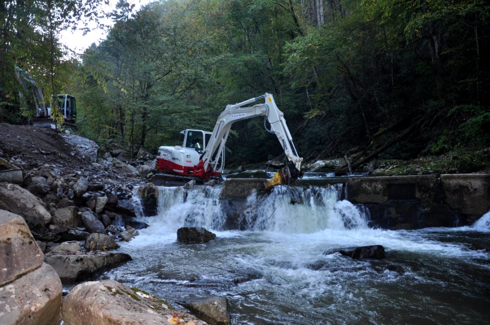 Citico Dam Removal in Region 4 - crane breaking apart the dam
