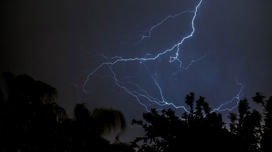 Dark black sky blue lightning
