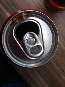 Cans coca top view operculum