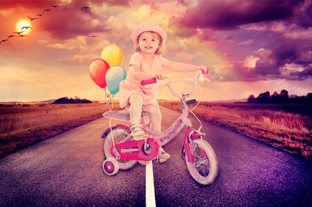 Baby girl cycling road
