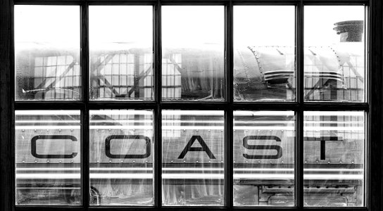 Photo of a train shot through a window at the NC Transportation Museum