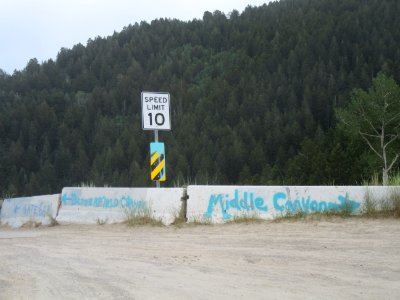 Spray Painted Dirt Road Sign