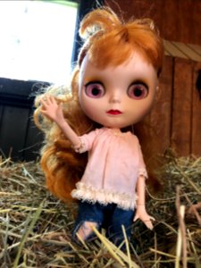 Climbing the hay bails in the feed room.