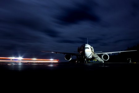A safety vehicle approaches United Airlines Flight 201 after the pilot made an emergency landing on Midway due to an electrical fire