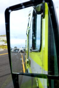 The Midway fire engine escorts a U.S. Coast Guard C-130 to the runway