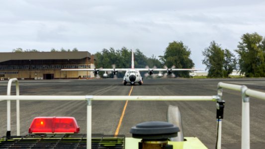The Midway fire engine escorts a U.S. Coast Guard C-130 to the runway