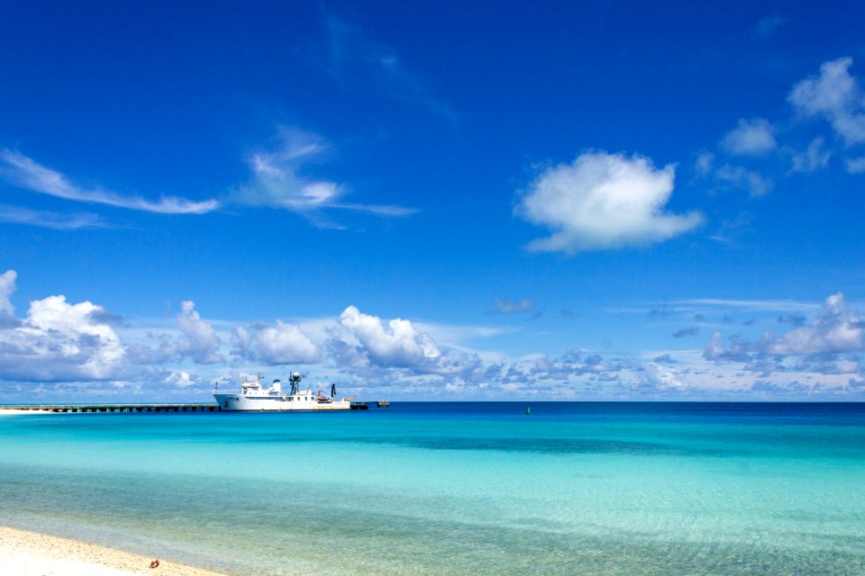 NOAA's marine debris ship, the Hi'ialakai, docked at Midway's cargo pier photo