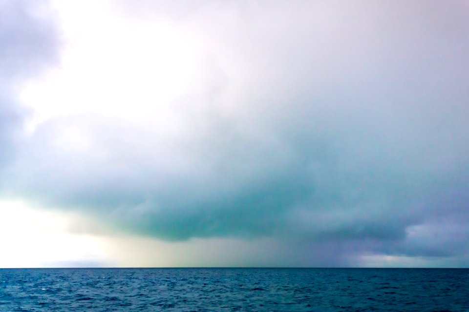 Very unusual colors in the clouds over Midway's lagoon