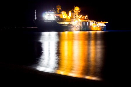 NOAA's marine debris ship, the Hi'ialakai, at night photo