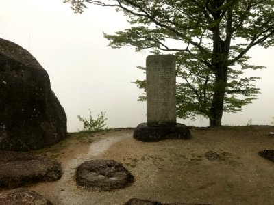 Stone Tablet in an ominous foggy backdrop