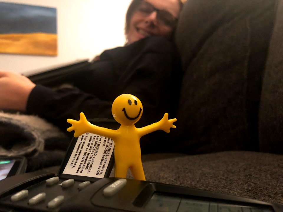 Happy Man Turns on the Fireplace