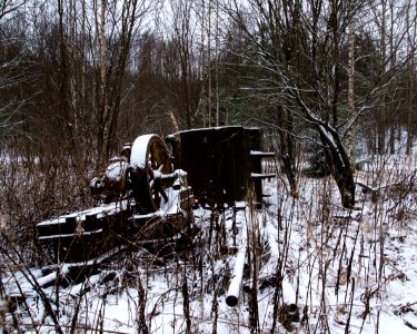 Antique excavation gear in a forest.