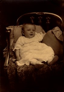 Baby Portrait With Pillows in Chair photo