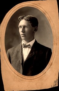 Unknown Male Portrait in Pin Stripe Suit and Bow Tie photo