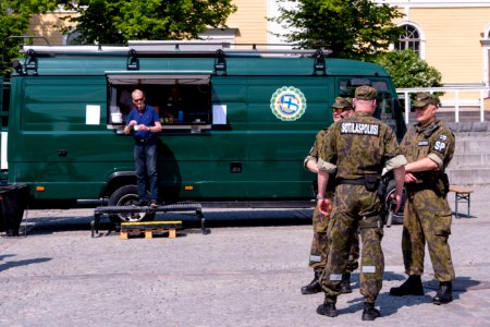 Finnish military police guarding the high value food truck of Soldiers home association photo