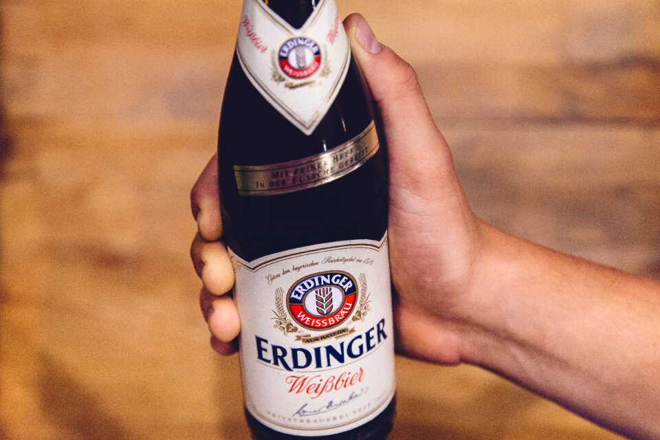 Holding white beer alcohol