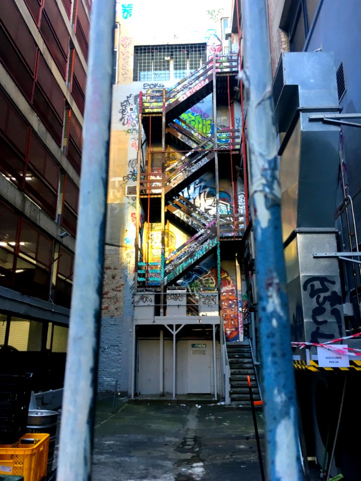 Graffiti Stairs Behind Bars