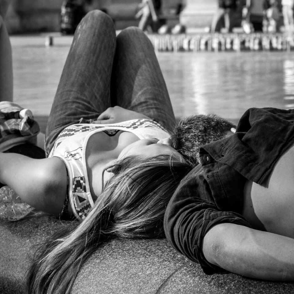 Tourists relax sunbathing