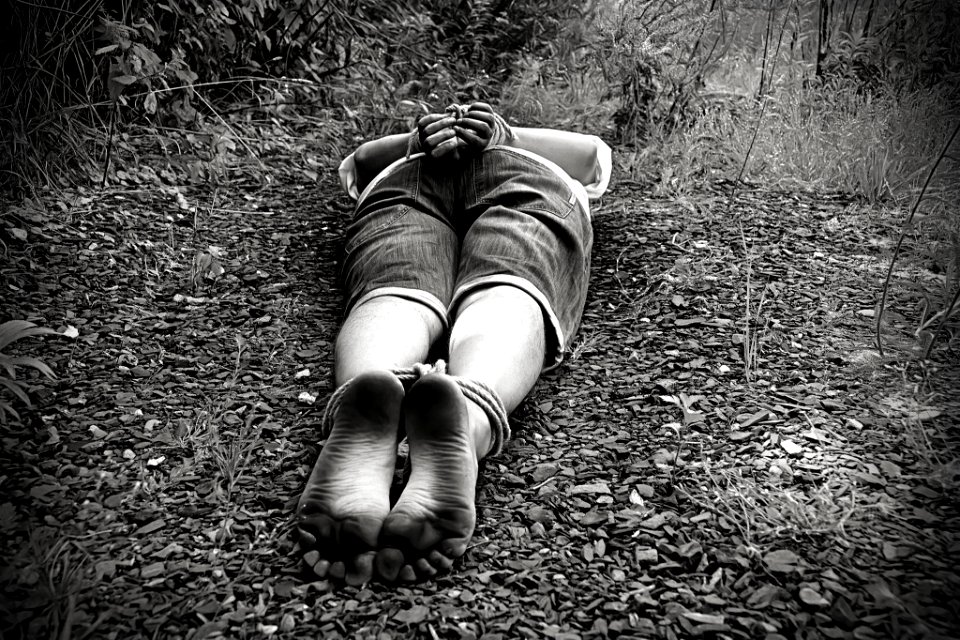 Kidnapped in forest barefoot photo