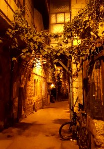 Narrow passageway - lights of night photo