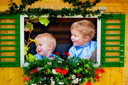 Children laugh flower bed photo